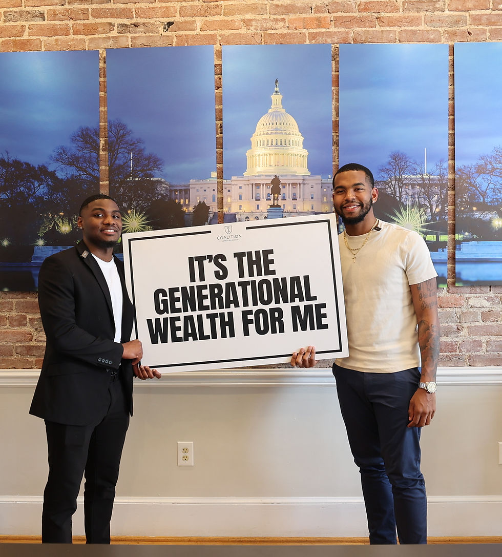 Two people standing in front of a brick wall and multi-panel Capitol artwork holding a sign that says IT'S THE GENERATIONAL WEALTH FOR ME