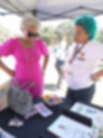The Newberry Institute staff member assisting community members with voter registration at a local event.
