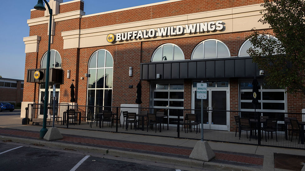 Buffalo Wild Wings restaurant exterior with patio tables and visible signage