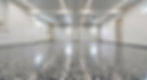 Empty garage with shiny speckled floor