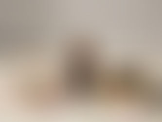 Amber serum bottle labeled Yeshua Skin on marble with spoon, powder, pink roses, petals, and stones. Dropper on golden tray. Calm setting.