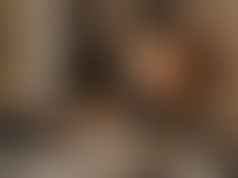 Tan headphones and YESHUA Skin Cosmetics set on a marble surface with a beige background create a stylish, luxurious mood.