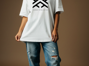 Woman in white T-shirt with "Yahweh Is Salvation" text, ripped jeans, leopard print shoes, black beanie. Neutral background. Casual style.