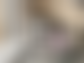 Skincare products on a marble countertop with a towel and plants. Sleek bottles and jars labeled "Protect," "Polished," "Calming," "Balance."