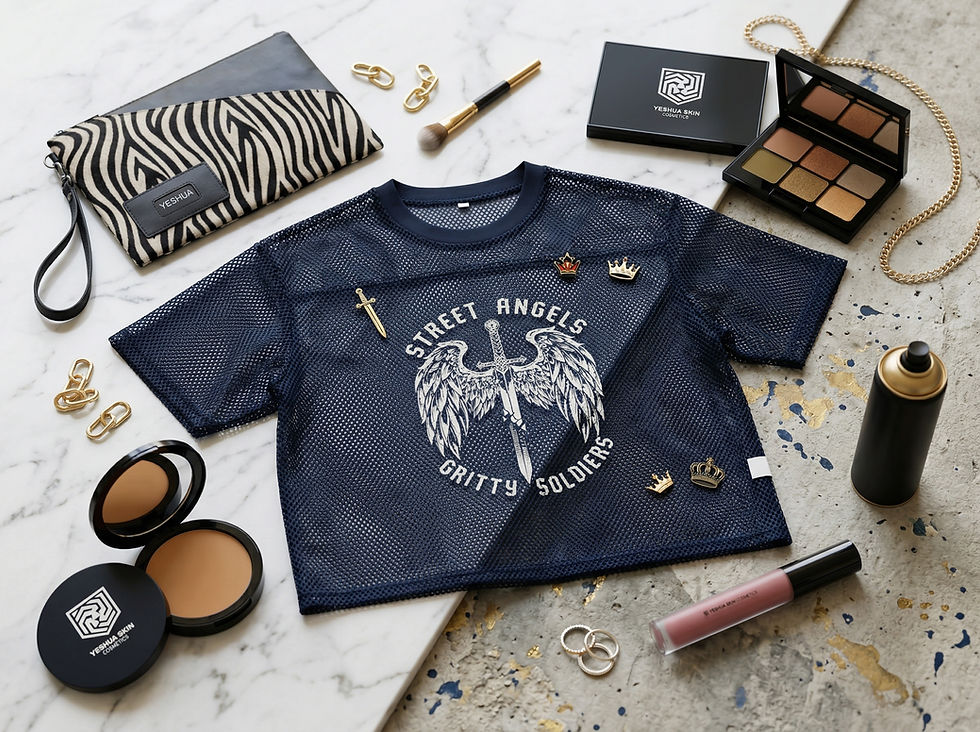 Navy mesh shirt with "Street Angels, Gritty Soldiers" text and crowns, surrounded by cosmetics, jewelry, zebra-pattern clutch on marble.
