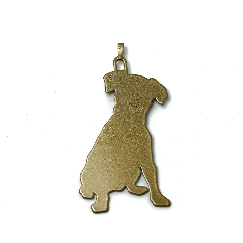 Gold puppy charm silhouette of a sitting dog.