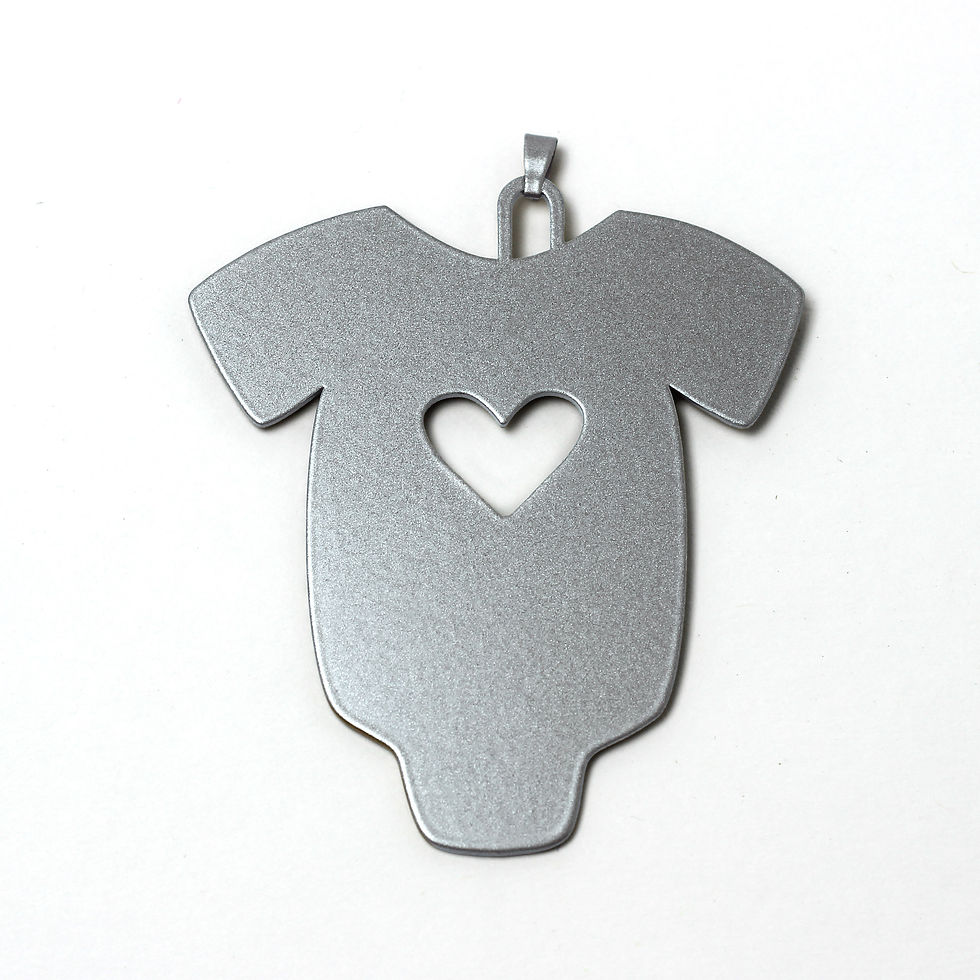 Silver baby onesie charm with heart cutout