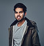portrait-bearded-indian-male-dressed-winter-jacket-grey-background