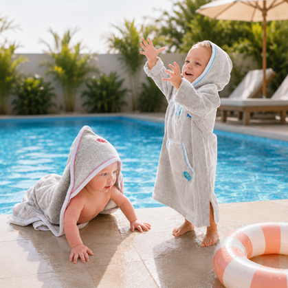 Splash About Apres Splash hooded towels and robes made from soft absorbent fabric to keep babies and toddlers warm after swimming