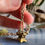Thumbnail: Antique Gold Filled Albertina Watch Chain T Bar and Enamelled Flower Basket Fob