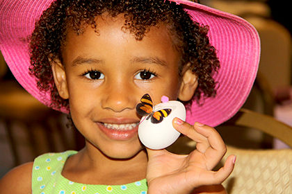wlittle girl with egg,butterfly