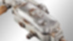 Close-up of a rusty metal device with bolts and screws. "UDP" is visible on its surface, set against a plain gray background.