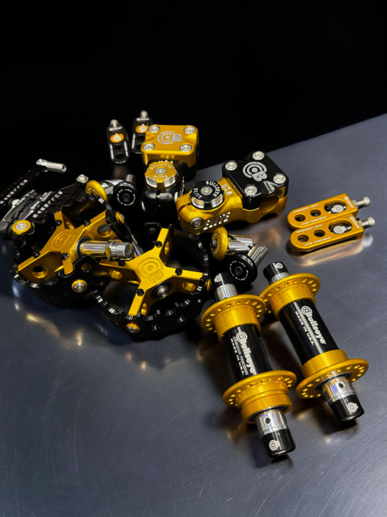 Thumbnail: BLACK AND GOLD GRAPHITE COMBO PEDALS HUBS ETC
