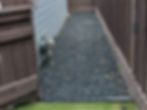 Blackstar Gravel pathway along a house side yard.