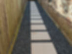Modern walkway with light pavers and Blackstar Gravel.