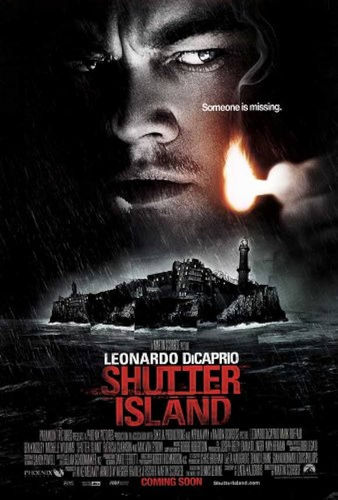 Close-up of Teddy Daniels (Leonardo DiCaprio) holding a match. Below him is Shutter Island. Below that in white lettering are the words: "Leonardo DiCaprio." Under that in red it says, "Shutter Island." 