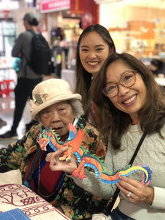 People holding dragon puppet
