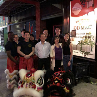 Lion dancers in front of DD Mau restaurant