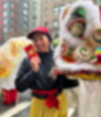 Leanne Yu of Chau Luen Athletics with a red pocket at the Chinatown Spring Festival Parade