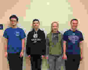 Band Students standing against wall
