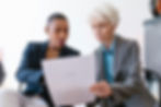 Two Women Looking the Document Together