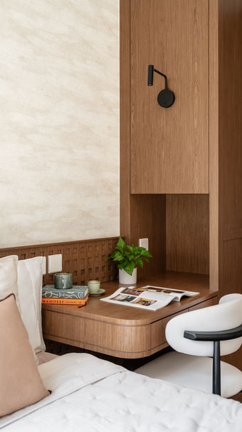 Modern interior design detail in Hong Kong featuring Chinese calligraphy brush and specialty coffee on a light oak table at Starview, Double Cove.