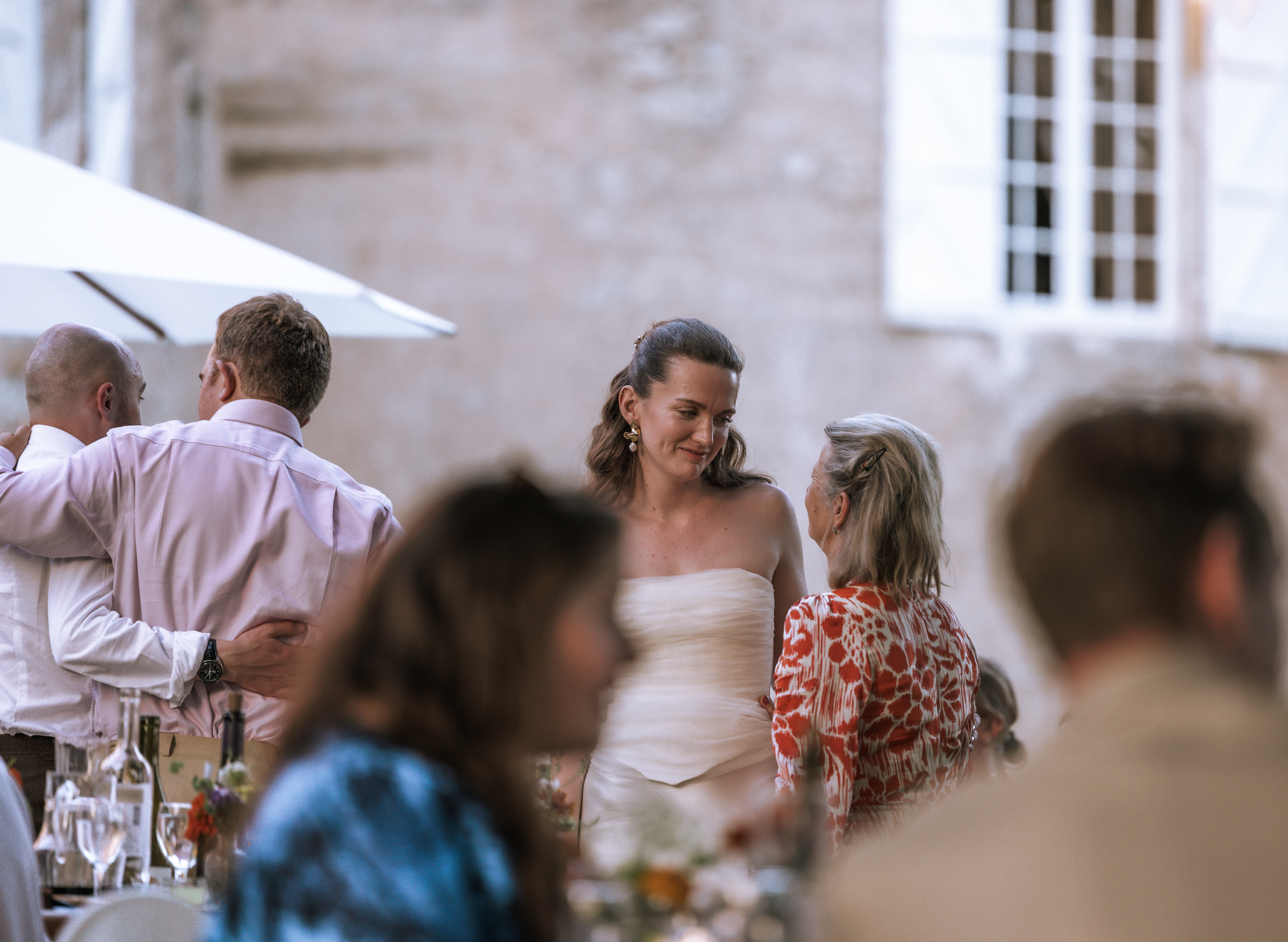 Bride with mother in law sharing a sweet moment in provence