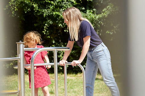 nanny with kid in a park