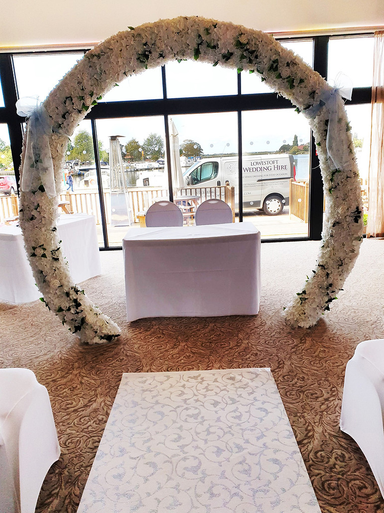 LOWESTOFT, lowestoft wedding hire, flower arch, the wherry hotel, oulton broad, suffolk, norfolk, the broads, waveney wedding, room with a view, outside patio area hotel, chair covers, sashes, wedding day, norfolk brides, suffolk brides, blue wedding day
