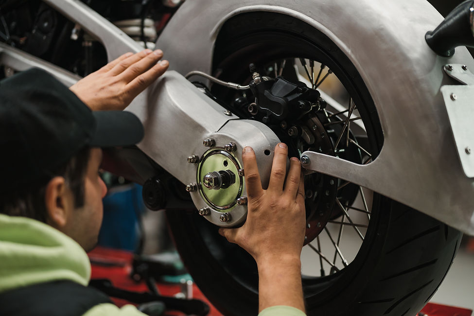 man-fixing-motorcycle-modern-workshop.jpg