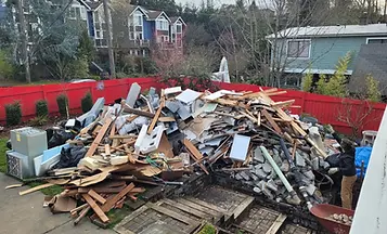 Junk removal truck loaded with unwanted items and debris.