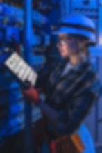 female-electrician-reads-digital-switchboard-plan-tablet-smartfactory-work.jpg