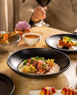 This image contains a dish photo named old delhi chicken, hot butter, fenugreek