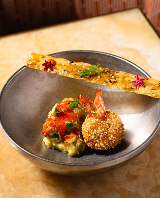 This image contains a dish image named tiger prawn, 'till bugga,amritsari vadi rice