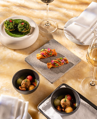 This image contains a dish image named goat's milk 'sholay', sultana ketchup