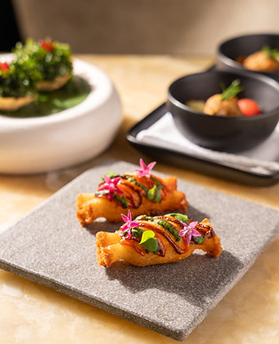 This image contains a photo of a dish named goats milk sholay from Indian Accent Mumbai