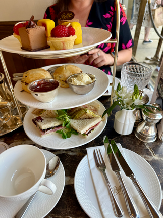 Afternoon tea stand with pastries, scones, and sandwiches. Date Ideas Harrogate.