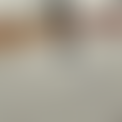 Person on a sled with arms raised in the air, indoor snow. Activities in Harrogate