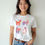 Thumbnail: Whimsical Alebrije Meadow Friends Unisex Printed Graphic T-Shirt