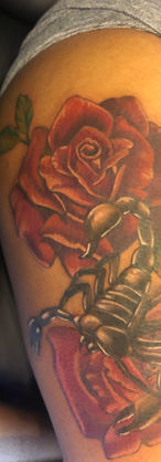 rose scorpion thigh color tattoo