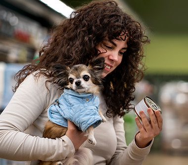 medium-shot-woman-buying-dog-food.jpg