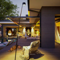 Courtyard pool of the l-shaped single story house design with 3 bedrooms featuring architectural lights