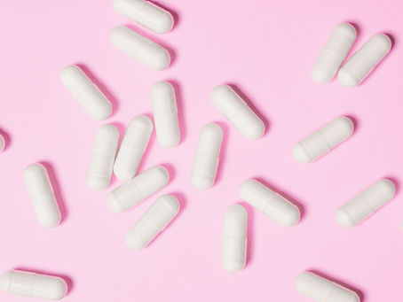 capsules on a pink background