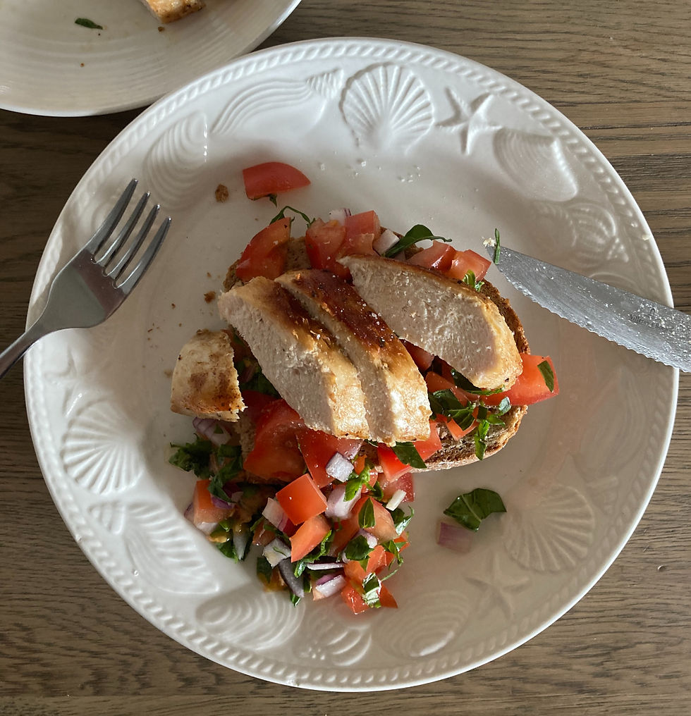 bruschetta topped with tomato and chicken