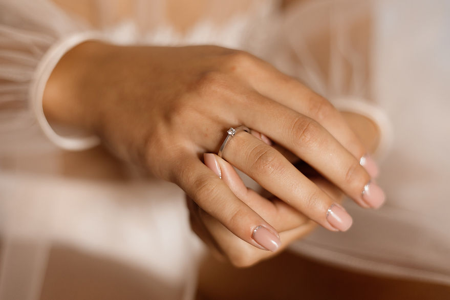 woman-with-engagement-ring-with-diamond-beautiful-manicure_Easy-Resize.com.jpg