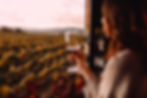 araffe-woman-holding-glass-wine-front-vineyard-generative-ai_Easy-Resize_edited.jpg