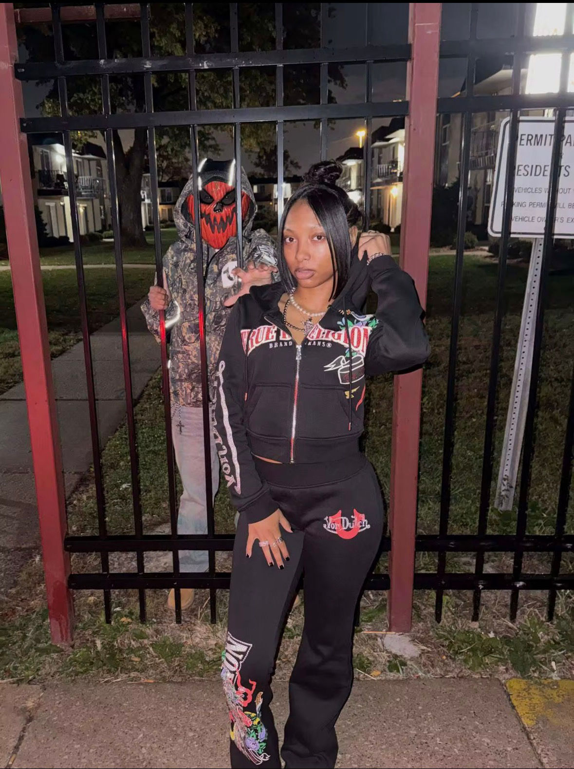Black True Religion tracksuit with colorful details.