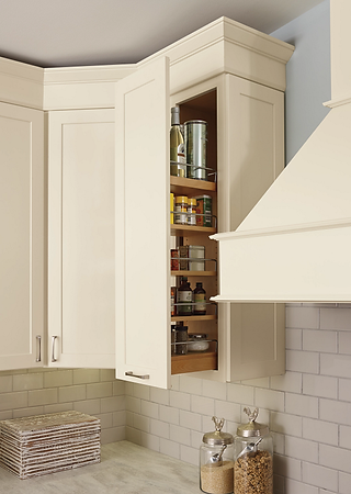 A roll out storage kitchen cabinet with white paint.