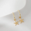 Thumbnail: Gold Starfish Earrings by One & Eight