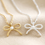 Thumbnail: Tiny Pearl Bow Pendant Necklace by Lisa Angel